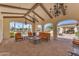 Inviting outdoor lounge area with comfortable seating and views of the community pool at 14200 W Village Pkwy # 2128, Litchfield Park, AZ 85340