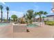 Relaxing hot tub and pool area surrounded by lush landscaping and comfortable lounge seating at 14200 W Village Pkwy # 2128, Litchfield Park, AZ 85340