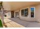 Covered back patio area features tile flooring and provides an excellent outdoor living space at 15226 S 14Th Dr, Phoenix, AZ 85045