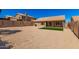Large backyard featuring gravel and a patch of green grass at 15226 S 14Th Dr, Phoenix, AZ 85045