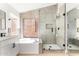 Modern bathroom with soaking tub, glass enclosed shower, and stylish fixtures at 15226 S 14Th Dr, Phoenix, AZ 85045