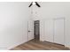 Bright bedroom features a ceiling fan and closet with wood-look flooring at 15226 S 14Th Dr, Phoenix, AZ 85045