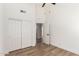 Bright bedroom with a ceiling fan and closet featuring wood-look flooring at 15226 S 14Th Dr, Phoenix, AZ 85045