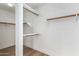 Walk-in closet featuring white walls and shelving on multiple levels at 15226 S 14Th Dr, Phoenix, AZ 85045