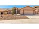 Charming single-story home featuring a well-manicured front yard and a two-car garage at 15226 S 14Th Dr, Phoenix, AZ 85045