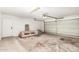 Spacious garage with a sofa and a white door at 15226 S 14Th Dr, Phoenix, AZ 85045