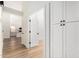 Hallway with modern cabinets and an open view to a clean, bright kitchen at 15226 S 14Th Dr, Phoenix, AZ 85045