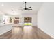 Bright living room featuring hardwood floors, neutral paint, and a ceiling fan at 15226 S 14Th Dr, Phoenix, AZ 85045
