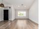 Bright open-concept living room featuring a laminate floor and natural light at 15226 S 14Th Dr, Phoenix, AZ 85045