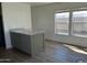 Bright kitchen nook with gray island and large windows allowing for natural light at 1550 W Southern Ave # 20, Phoenix, AZ 85041