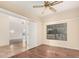 Bedroom with window, hardwood floors, ceiling fan and multiple entryways at 15602 N 19Th St, Phoenix, AZ 85022