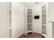 Spacious walk-in closet with custom white shelving and ample storage space at 15602 N 19Th St, Phoenix, AZ 85022