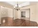 Open dining area with hardwood floors, chandelier, and seamless flow to other living spaces at 15602 N 19Th St, Phoenix, AZ 85022