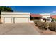 Charming single-story home featuring a three-car garage, desert landscaping, and a classic red tile roof at 15602 N 19Th St, Phoenix, AZ 85022