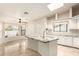 Bright eat-in kitchen with granite counters, a tiled floor and a skylight at 15602 N 19Th St, Phoenix, AZ 85022