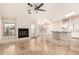 Open living space with fireplace, access to the backyard, and a view of the kitchen island at 15602 N 19Th St, Phoenix, AZ 85022