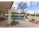 Inviting pool with mature landscaping offers a private backyard oasis at 15602 N 19Th St, Phoenix, AZ 85022