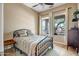 Bright bedroom showcasing a cozy bed, windows, and neutral decor, perfect for relaxation at 17493 W Arroyo Way, Goodyear, AZ 85338