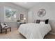 Comfortable bedroom featuring a stylish bed, shutters for natural light, and a decorative wall piece at 19403 E Apricot Ln, Queen Creek, AZ 85142