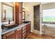 Elegant bathroom featuring dual vessel sinks, a shower, and a separate soaking tub at 1943 E Paso Nuevo Dr, Phoenix, AZ 85086