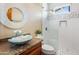 This bathroom features a decorative sink and a glass-enclosed shower at 1943 E Paso Nuevo Dr, Phoenix, AZ 85086