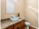 This powder room features a decorative glass sink on a granite countertop at 1943 E Paso Nuevo Dr, Phoenix, AZ 85086