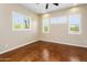 This spacious, comfortable bedroom features modern windows, tan walls, and a ceiling fan at 1943 E Paso Nuevo Dr, Phoenix, AZ 85086