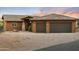 Charming exterior elevation showcasing a well-maintained home with a tile roof and three-car garage at 1943 E Paso Nuevo Dr, Phoenix, AZ 85086