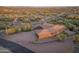 Lovely home showcasing a tile roof, attached two car garage, and natural desert landscaping at 1943 E Paso Nuevo Dr, Phoenix, AZ 85086