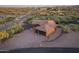 Beautiful property featuring a tile roof, an attached two car garage, and natural desert landscaping at 1943 E Paso Nuevo Dr, Phoenix, AZ 85086