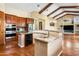Open kitchen featuring granite countertops, custom cabinets, stainless appliances, and an island at 1943 E Paso Nuevo Dr, Phoenix, AZ 85086