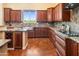 Bright kitchen showcases stainless steel sink, wine storage, and custom cabinetry at 1943 E Paso Nuevo Dr, Phoenix, AZ 85086