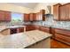 Open kitchen boasts granite countertops, a central island, and modern fixtures at 1943 E Paso Nuevo Dr, Phoenix, AZ 85086