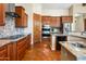 Modern kitchen featuring granite countertops, custom cabinets, and stainless steel appliances at 1943 E Paso Nuevo Dr, Phoenix, AZ 85086