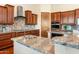 Elegant kitchen with granite countertops, stainless steel appliances, and custom cabinetry at 1943 E Paso Nuevo Dr, Phoenix, AZ 85086
