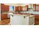 Spacious kitchen features wooden cabinets, granite countertops, and stainless steel appliances at 1943 E Paso Nuevo Dr, Phoenix, AZ 85086