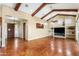 Open-concept living room with dark wood trim and an entryway leading to the bedrooms at 1943 E Paso Nuevo Dr, Phoenix, AZ 85086