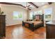 This expansive main bedroom features wooden beams, high ceilings and abundant natural light at 1943 E Paso Nuevo Dr, Phoenix, AZ 85086