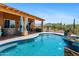 This refreshing pool is set against a lovely patio with an outdoor kitchen and desert views at 1943 E Paso Nuevo Dr, Phoenix, AZ 85086