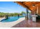 This refreshing pool is set against a lovely patio with an outdoor kitchen at 1943 E Paso Nuevo Dr, Phoenix, AZ 85086