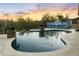 In-ground pool featuring desert landscaping, basketball hoop, and pool cleaning system at 1943 E Paso Nuevo Dr, Phoenix, AZ 85086