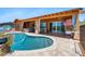 This refreshing pool is set against a lovely patio with an outdoor kitchen and hot tub at 1943 E Paso Nuevo Dr, Phoenix, AZ 85086
