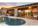 Backyard pool with a covered patio, hot tub, bar, and outdoor grill at 1943 E Paso Nuevo Dr, Phoenix, AZ 85086