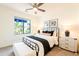 Cozy bedroom with modern decor, a large window, and plenty of natural light at 2511 W Queen Creek Rd # 325, Chandler, AZ 85248