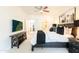 Stylish bedroom showcasing king bed, modern decor, and en-suite bathroom access at 2511 W Queen Creek Rd # 325, Chandler, AZ 85248