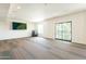 Spacious bonus room with large windows, sliding glass door, and neutral color palette perfect for various activities at 2511 W Queen Creek Rd # 325, Chandler, AZ 85248