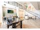 Elegant dining area with views of the main staircase, stylish lighting, and herringbone pattern flooring at 2511 W Queen Creek Rd # 325, Chandler, AZ 85248
