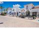 Upscale community with charming outdoor dining, white stucco buildings and inviting storefronts at 2511 W Queen Creek Rd # 325, Chandler, AZ 85248
