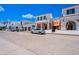 Upscale community featuring a white stucco exterior, terracotta tile roof, and inviting storefronts at 2511 W Queen Creek Rd # 325, Chandler, AZ 85248