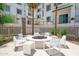 Community outdoor seating area with a cozy firepit to enjoy on cool nights at 2511 W Queen Creek Rd # 325, Chandler, AZ 85248